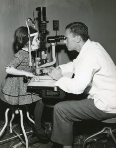 Dohlman, Claes, examining a pediatric patient in undated photo.