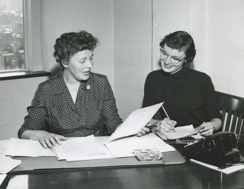 Leona Zacharias (left) and Susan Larson (right) discussing research on retrolental fibroplasia research, in connection with a new research wing, in 1956.
