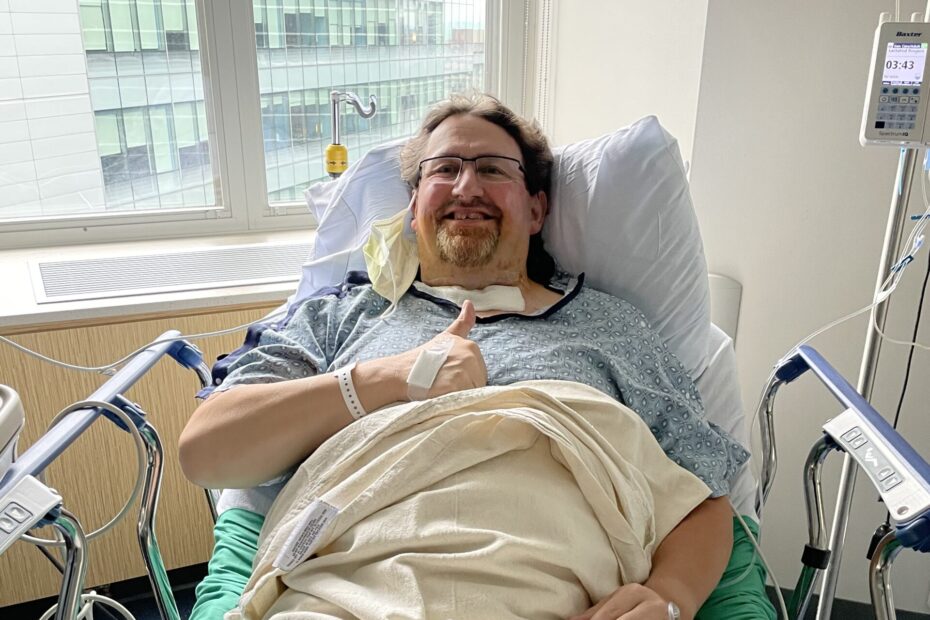Dan Kenney lays in a hospital bed as he recovers from his car accident.