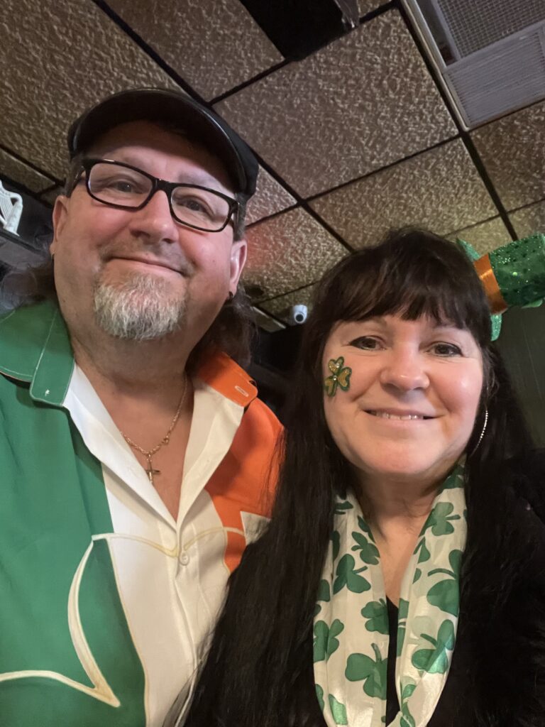 Dan Kenney poses with his wife Kim while dressed up for St. Patrick's Day.