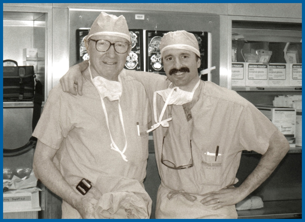 Drs. William Montgomery (left) with Mark A. Varvares, (right) in the operating room wearing scrubs in this undated black and white photo.