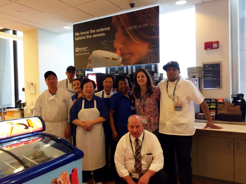 Members of the Food Services team photographed in 2017: Left to right, standing: Lop Chan, Nuno Barbosa, Andrea Ioannidis, Margaret Lau, Suzy Chau, Ethel Hargrove, Joanna Athanasiou, and Walter Meeks. Kneeling: Mike Comora