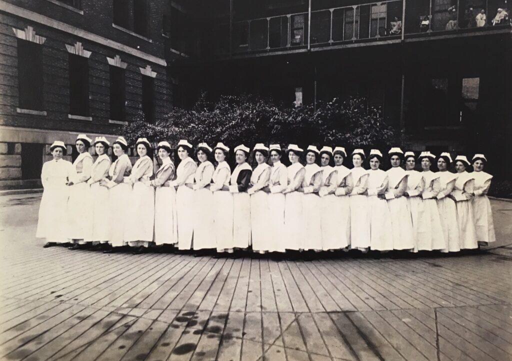 24 student nurses posing in this 1920 photograph