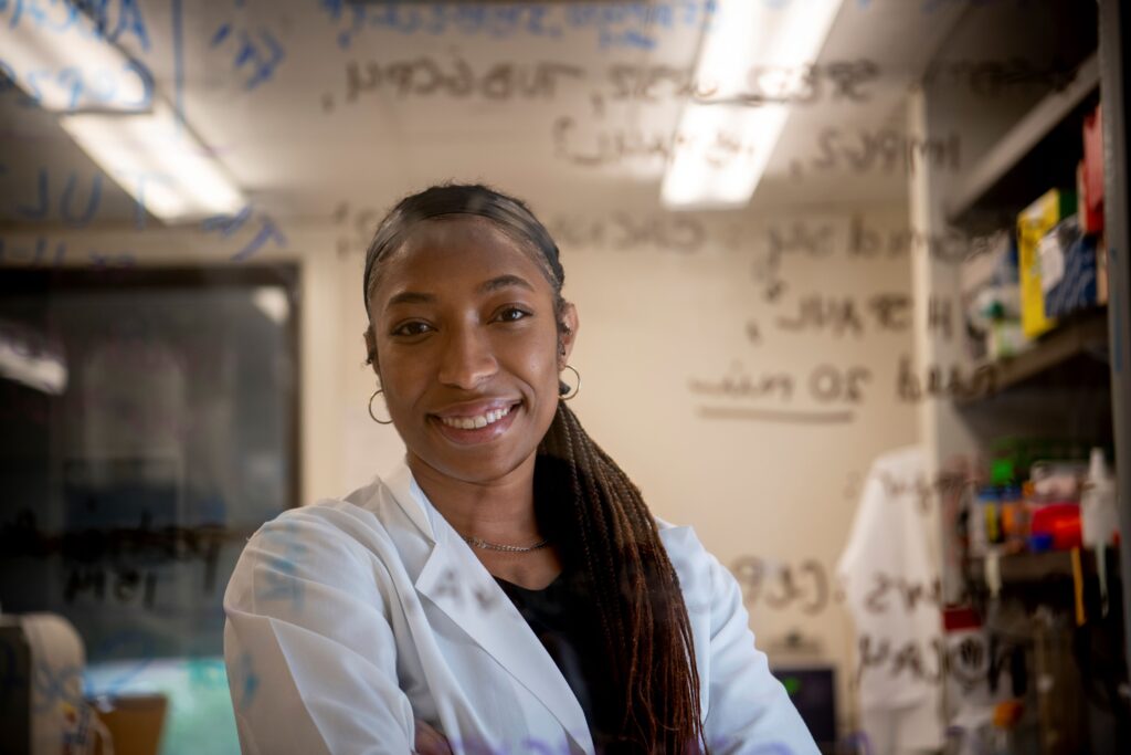 Research Scholar alumna Cherrell Price photographed in this portrait in the laboratory at Mass Eye and Ear.